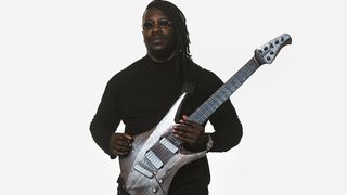 The Ernie Ball Music Man Kaizen Gallium has a custom aged metallic finish, making Tosin Abasi's signature electric guitar look like an alien artefact