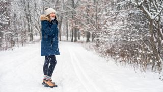 A woman out walking in the snow