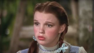 Judy Garland looking worried as Dorthy in The Wizard of oz