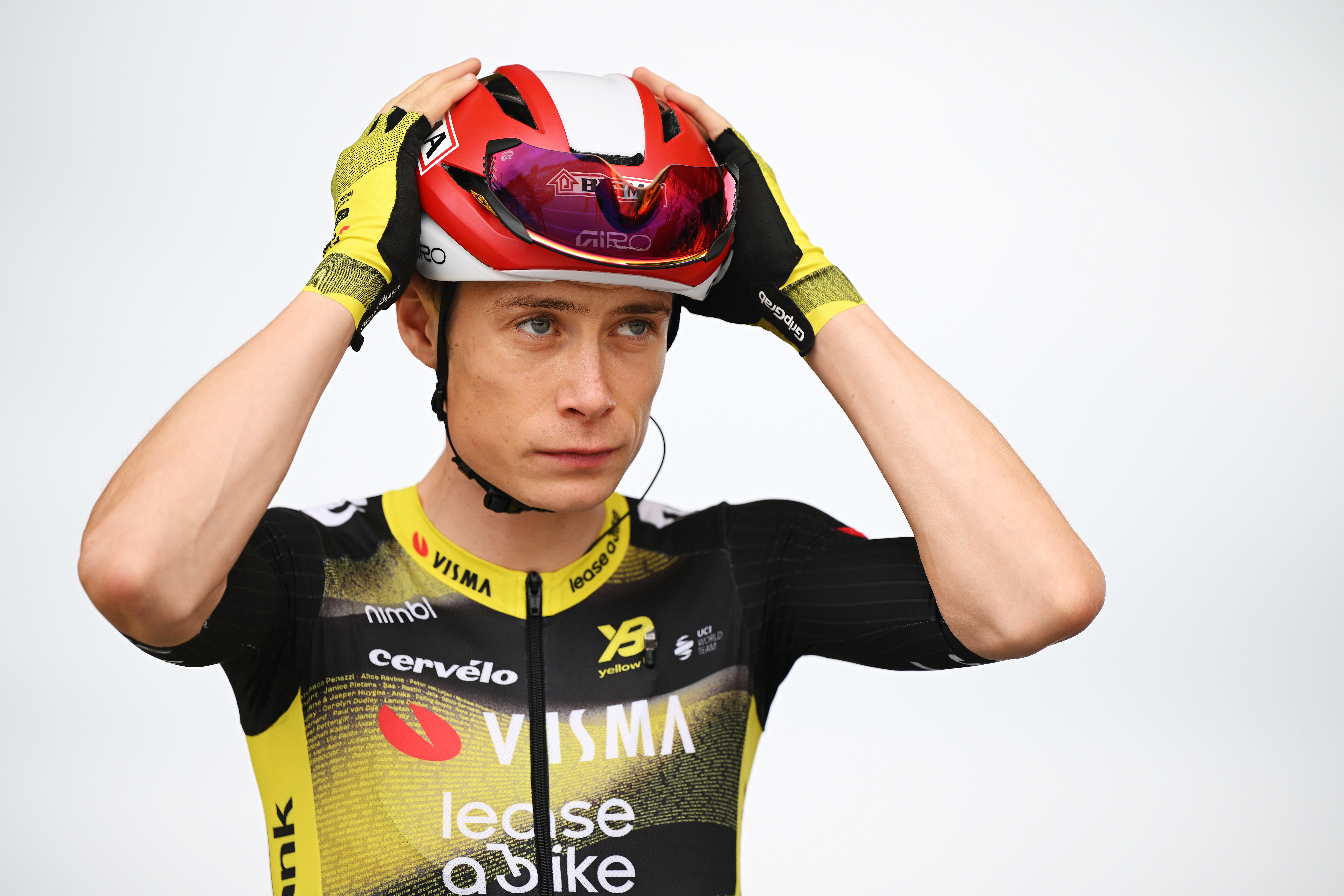Jonas Vingegaard adjusting his helmet