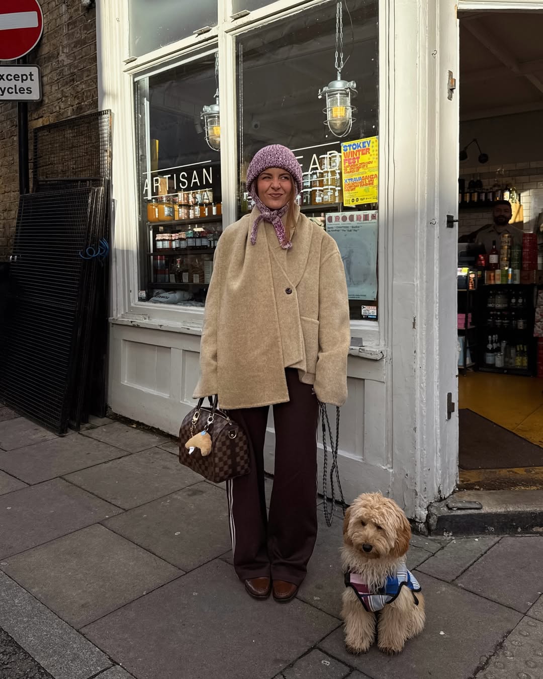 Rebecca Olivia wears her track pants with a scarf collar jacket.