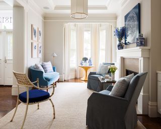 Blue and cream living room with sofa, armchairs