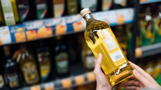 Bottle of olive oil on the shelf