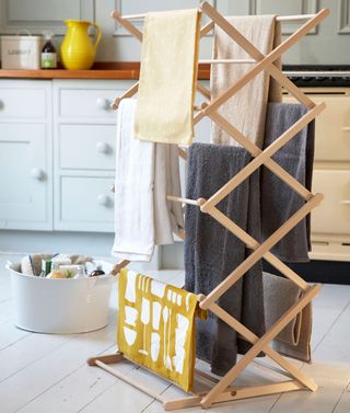 laundry room with folding wooden clothes horse