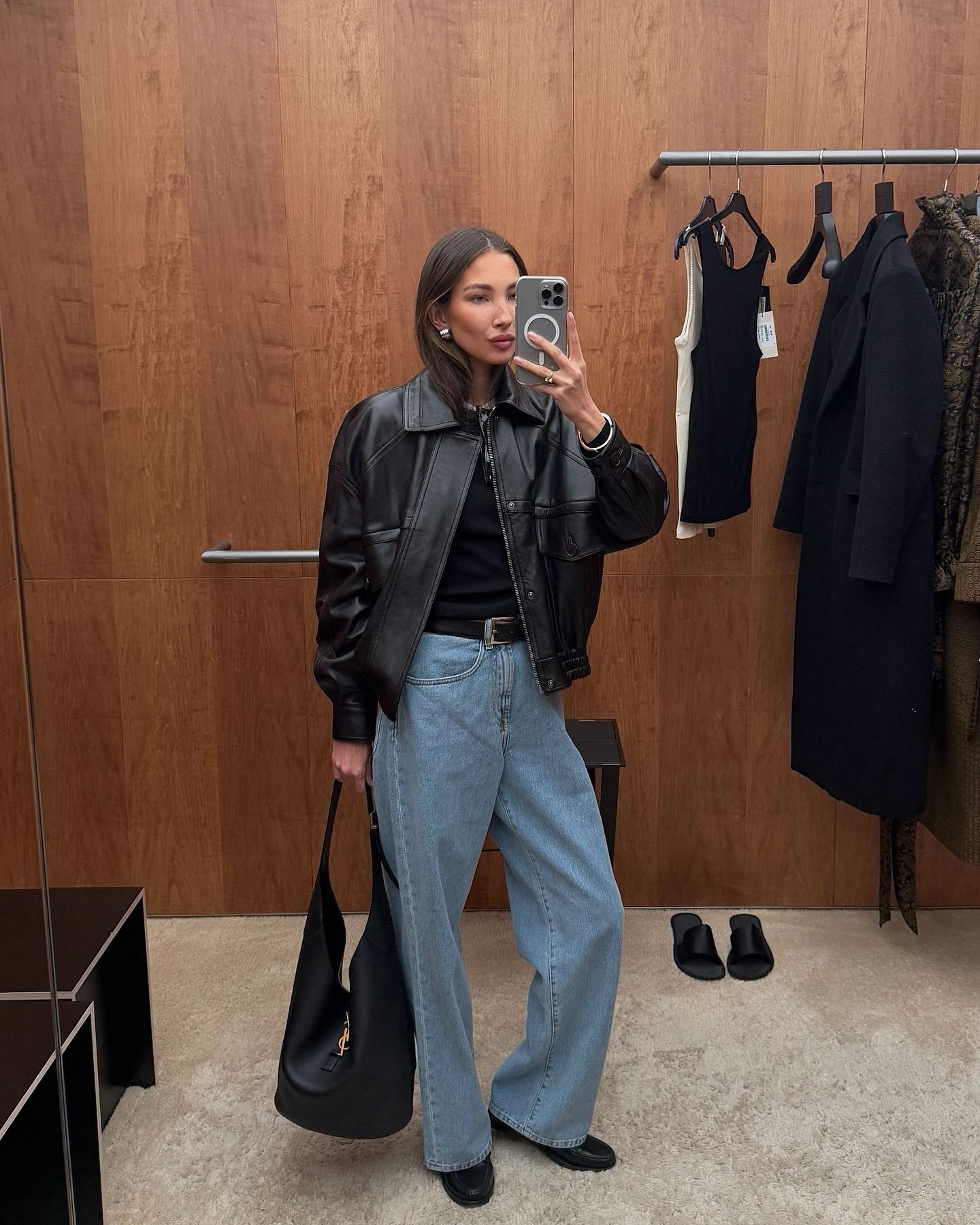 Influencer Felicia Akerstrom wearing a leather bomber jacket and baggy jeans