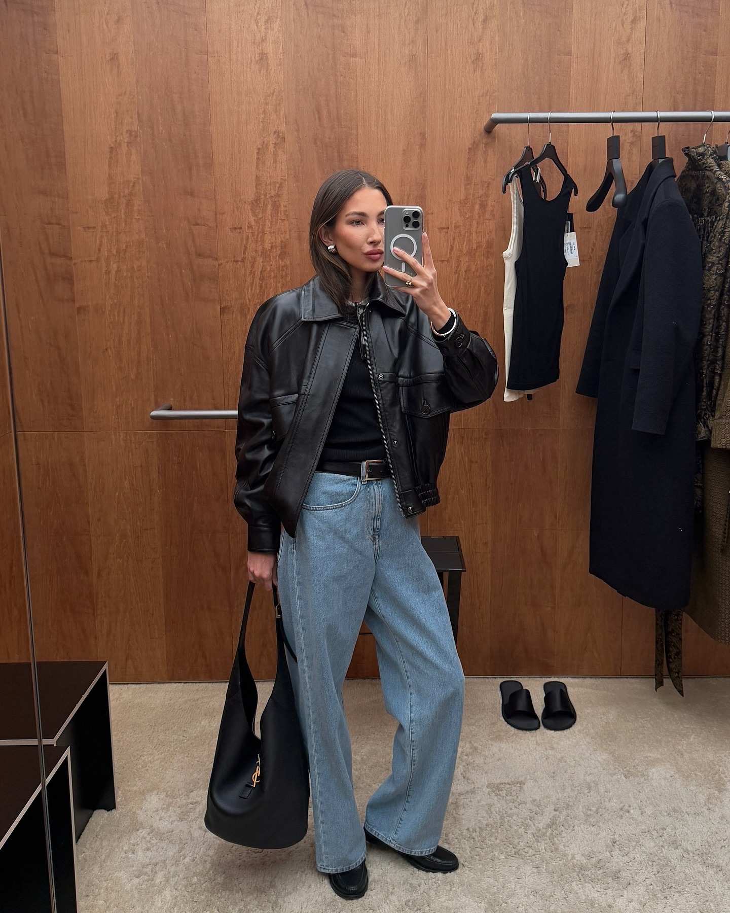 Influencer Felicia Akerstrom wearing a leather bomber jacket and baggy jeans