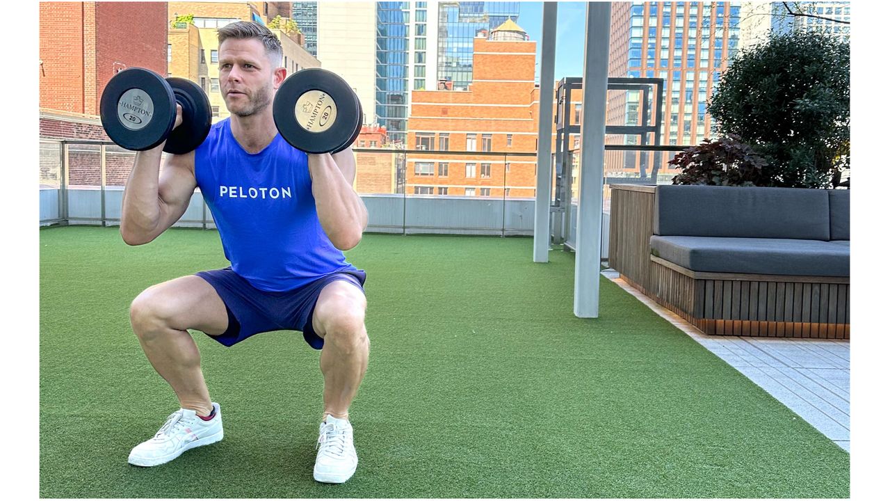 Andy Speer performing a dumbbell thruster
