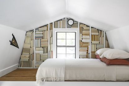 a bedroom with books all turned backwards