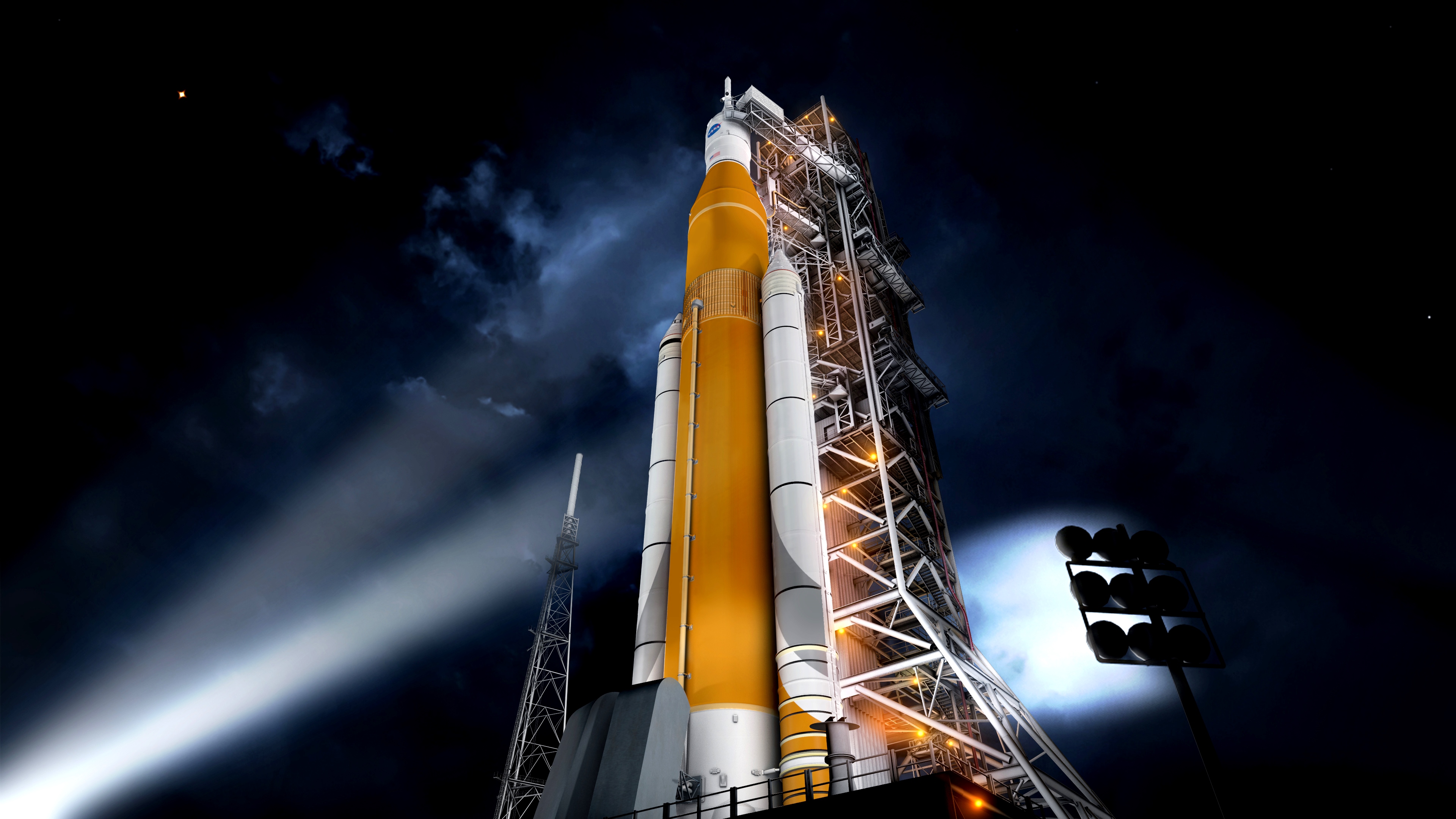 An artist&#039;s illustration of NASA&#039;s massive Space Launch System rocket and its Orion capsule on the launchpad.