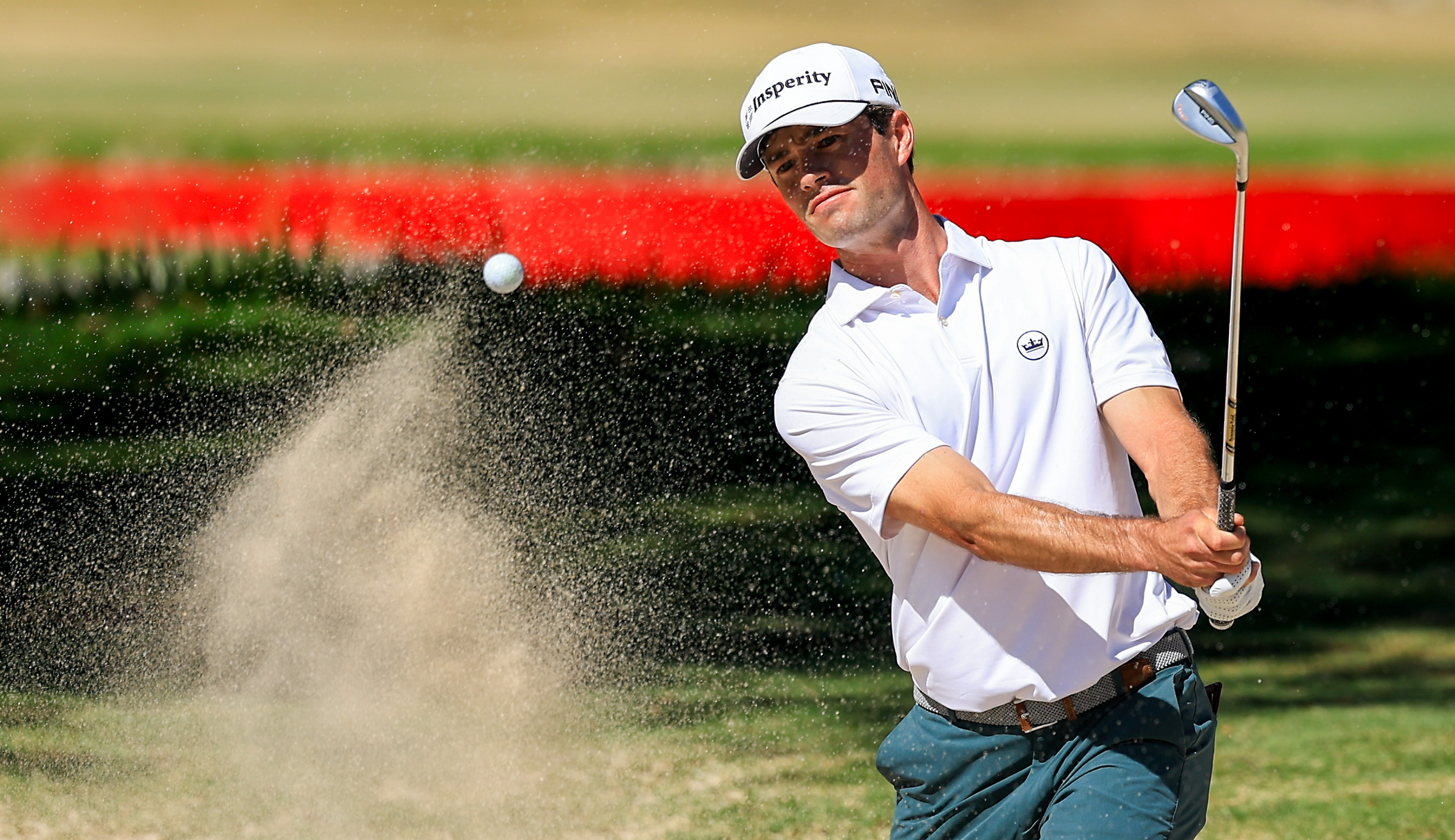 Cole Hammer hits a bunker shot