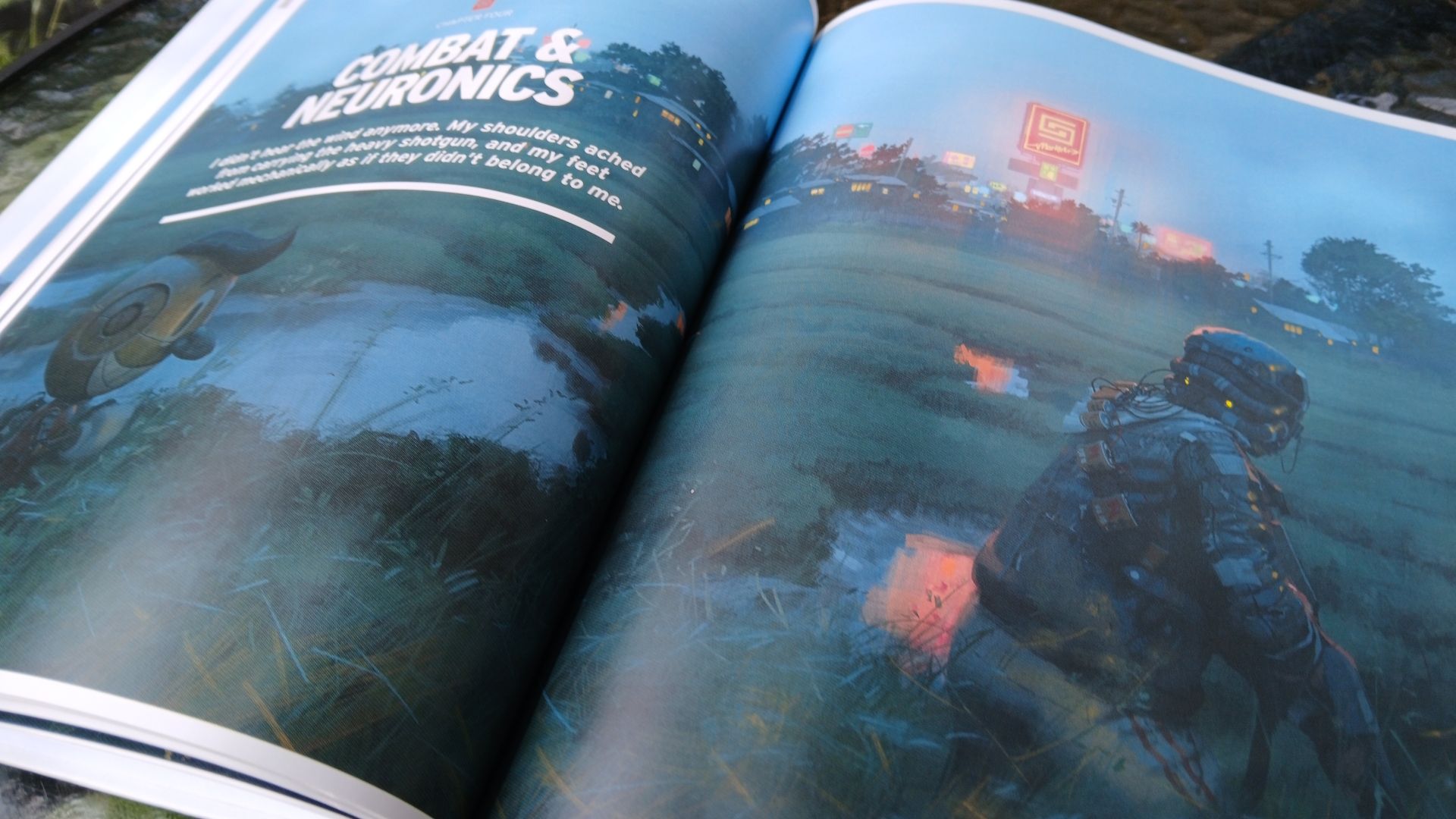 The Electric State Roleplaying Game book open on pages of artwork and text