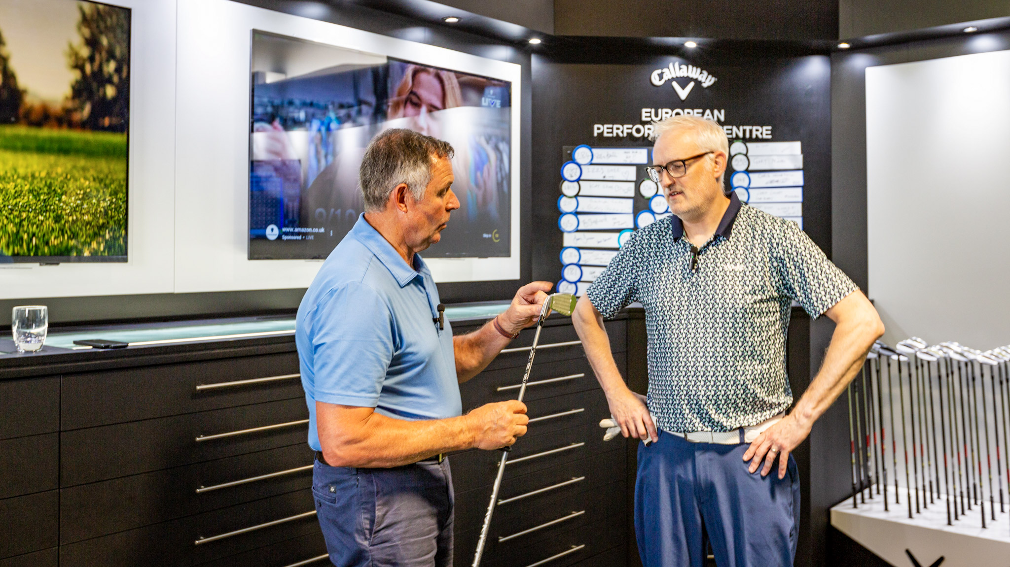 Callaway fitter Keith Simmonds shows Rob Spedding a Callaway iron