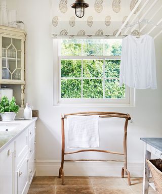laundry room with wooden drying rack and shirt
