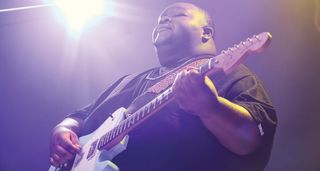 Christone 'Kingfish' Ingram plays his signature Tele Deluxe onstage.