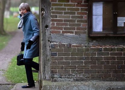 Britain's Theresa May leaves church before Brexit vote