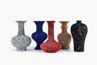 Four different shaped vases, on grey, blue, red and beige.