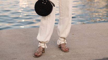 woman wearing linen pants and sandals