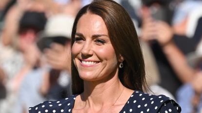 Catherine, Duchess of Cambridge holds the Wimbledon Trophy at the Wimbledon Men's Singles Final at All England Lawn Tennis and Croquet Club on July 10, 2022 in London, England.