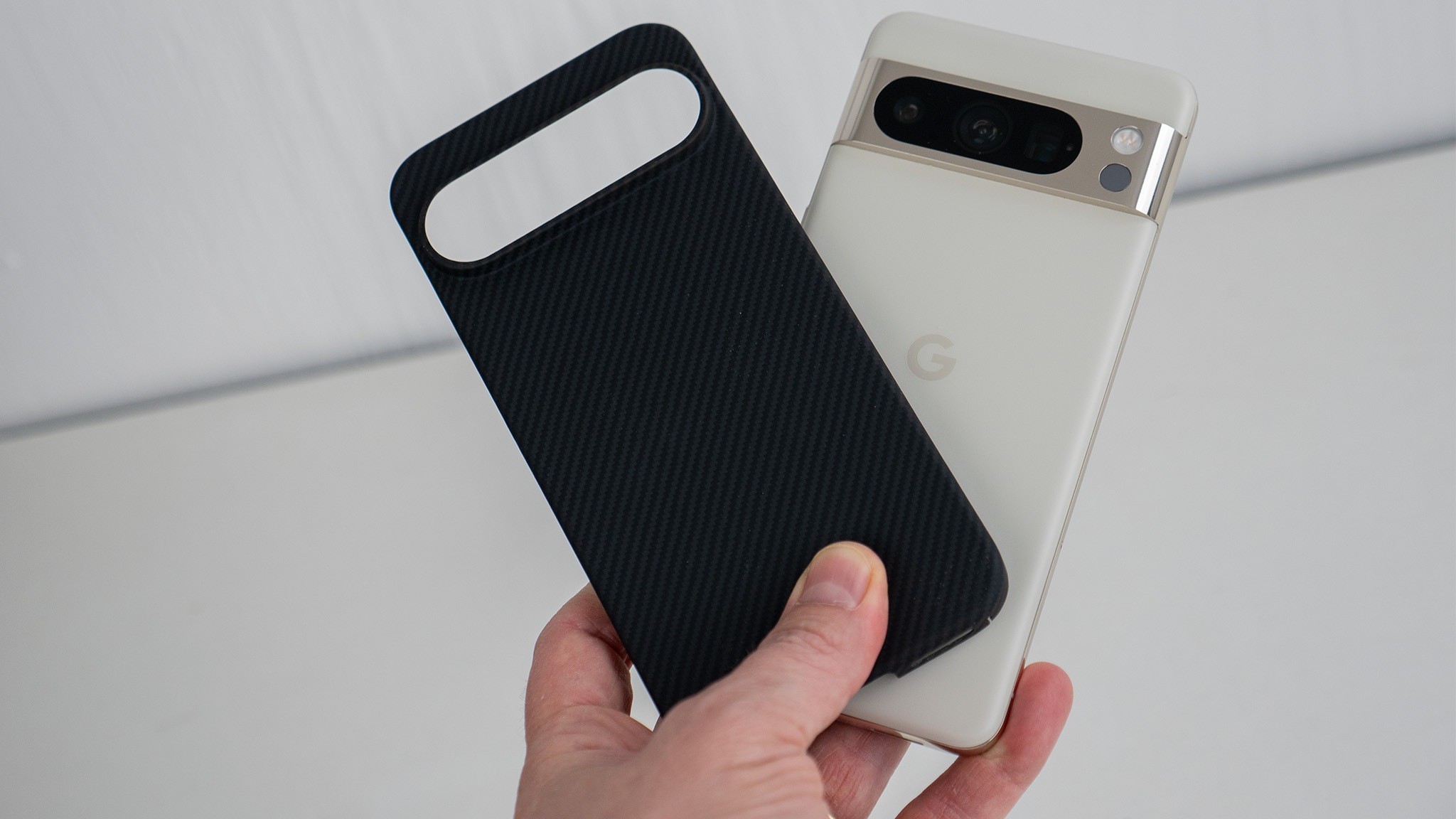 A Thinborne aramid fiber case made for an upcoming Google Pixel 9 phone alongside a Google Pixel 8 Pro