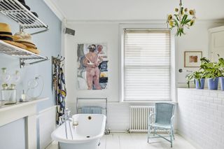 Pale blue bathroom with freestanding bath