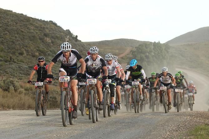 Bobby Behan of Fighting Boyz leads a group along the route during stage 3