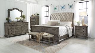 neutral bedroom with dark wood furniture to contrast