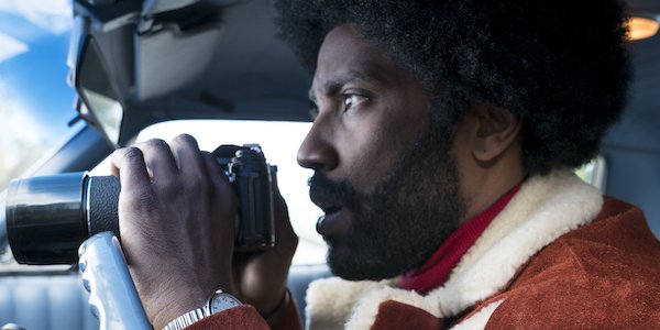 Blackkklansman John David Washington Ron Stalworth holding binoculars