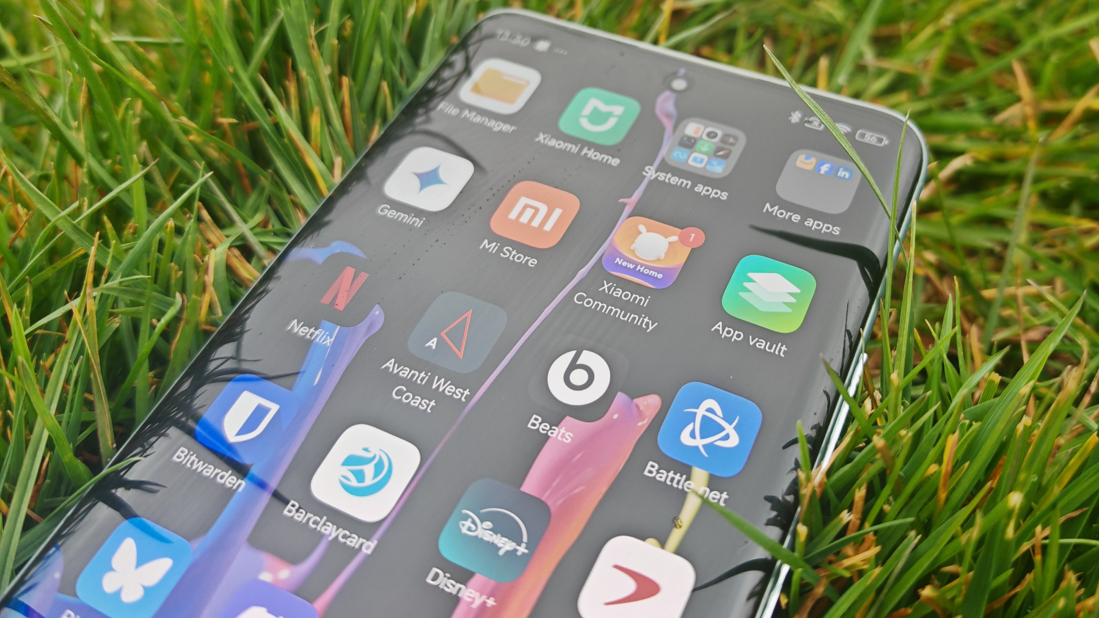 Xiaomi Redmi Note 14 Pro Plus 5G phone in hand and on grass showing homescreens and cameras up close