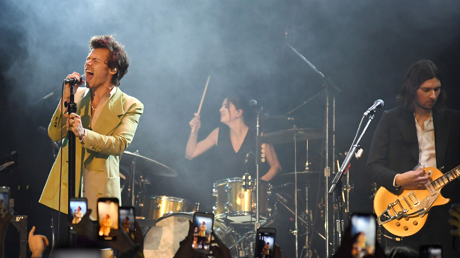 Harry Styles, drummer Sarah Jones and Mitch Rowland (playing his goldtop Gibson Les Paul) onstage at The Bowery Ballroom on February 29, 2020