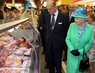 Britain's Queen Elizabeth II and Prince Philip, the Duke of Edinburgh visit the English market in Cork, on the last day of her four-day visit to Ireland, on May 20, 2011