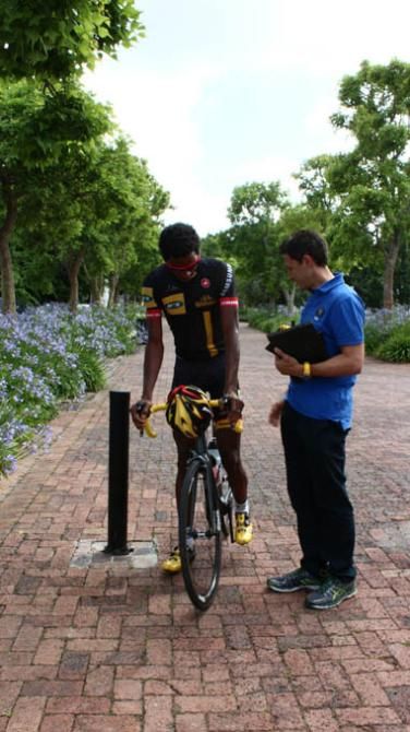 Daniel Teklehaimanot talks to team boss Doug Ryder