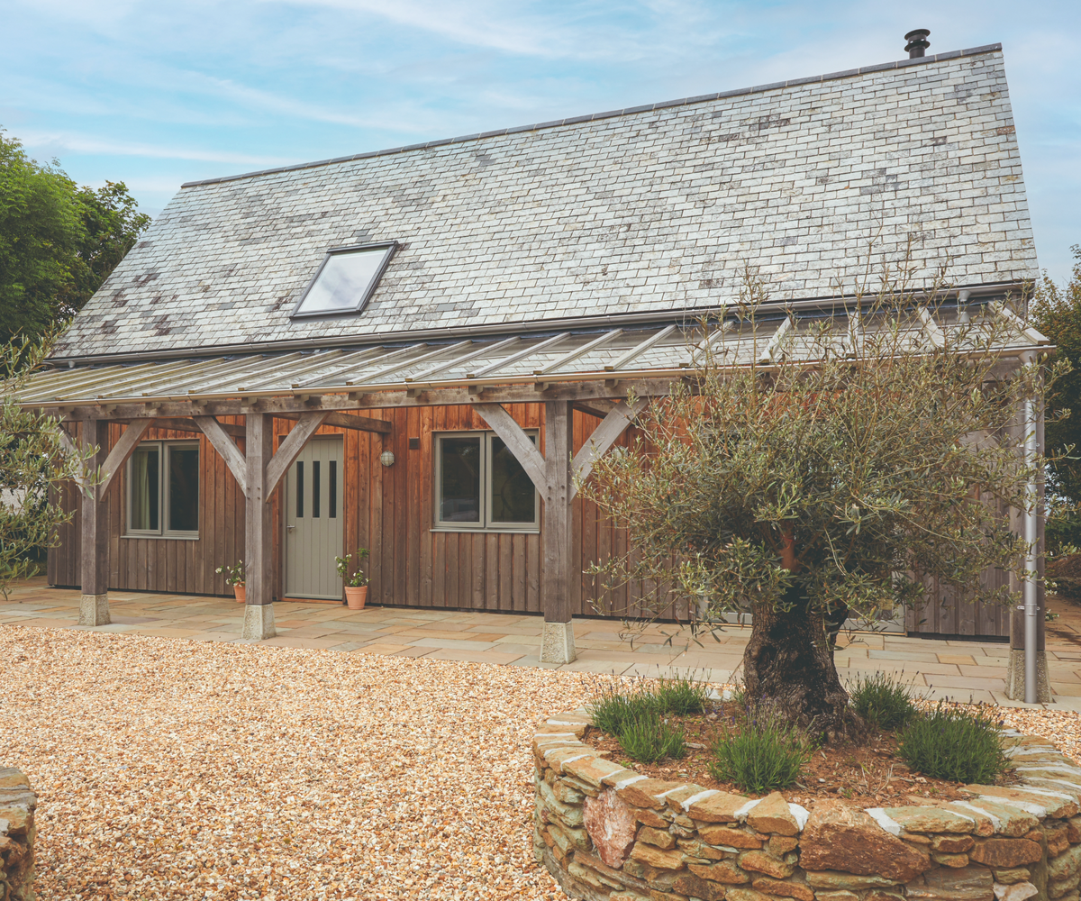 Exterior of the front of the house with a gravel drive way