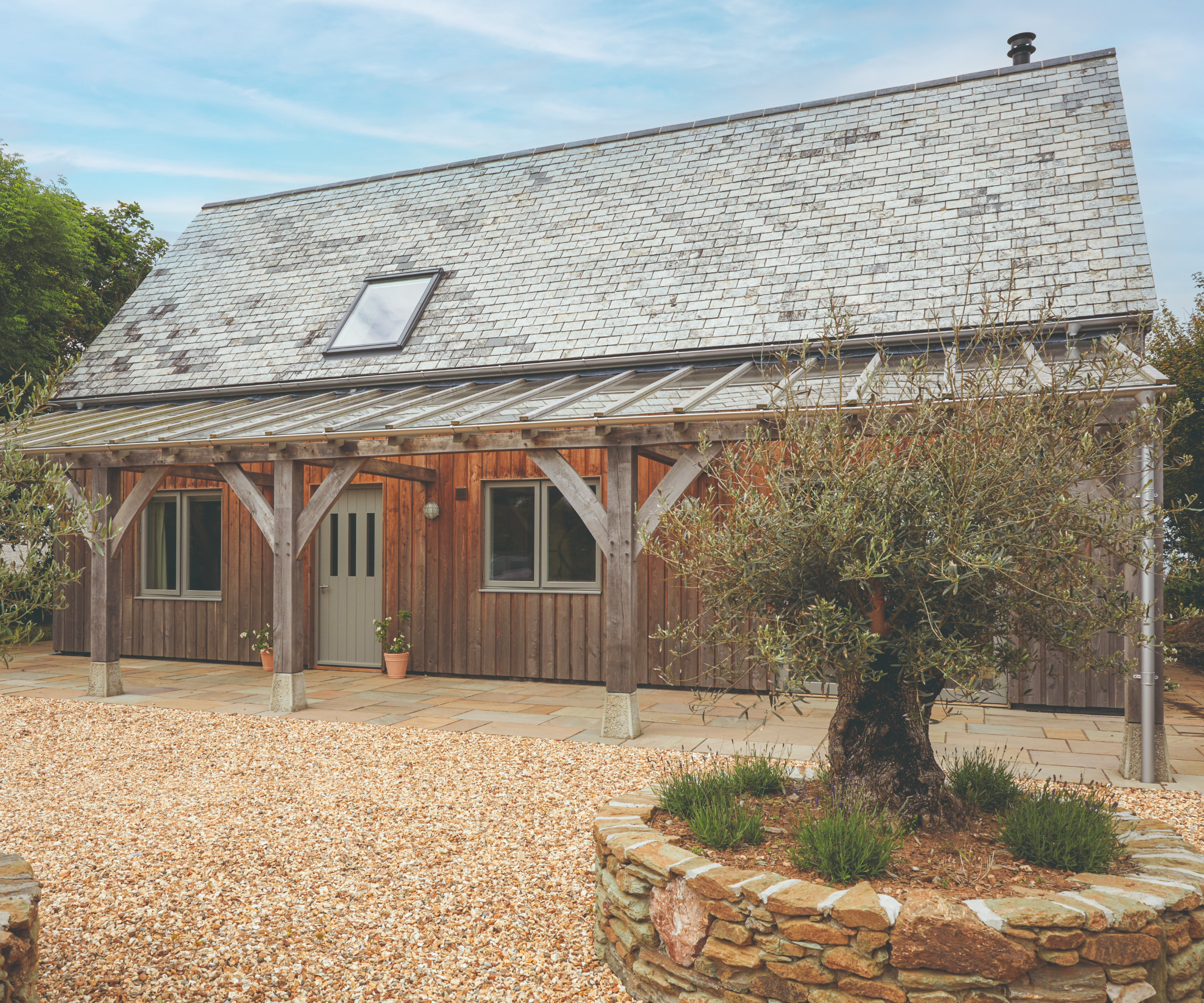 Exterior of the front of the house with a gravel drive way
