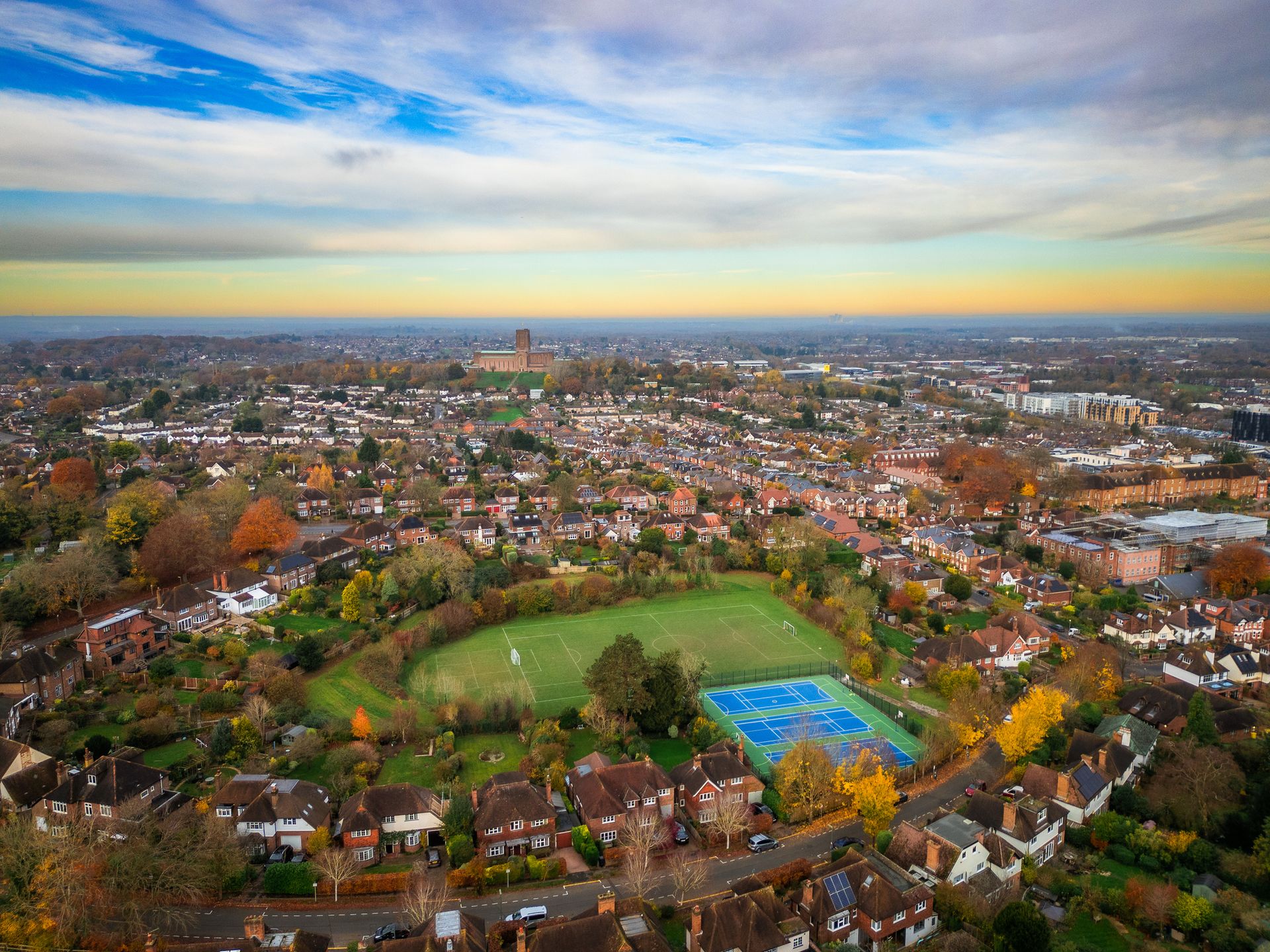 Aerial view over residential streets and houses in city of Guildford