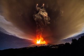 Strombolian eruptions, which produce ash, tephra and lava fountains, are fairly common in Mount Etna's craters.