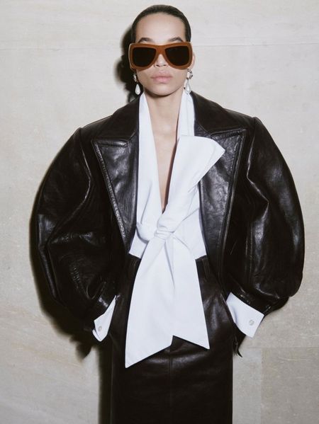 woman in sunglasses and leather jacket