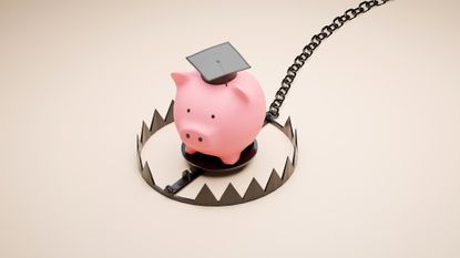 Piggy bank wearing a graduation cap stuck inside an animal trap