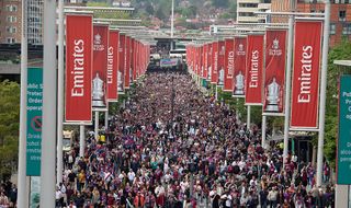 Fans walking down Wembley way are seen prior to the Emirates FA Cup Semi Final match between Crystal Palace and Aston Villa at Wembley Stadium on April 26, 2025 in London, England.