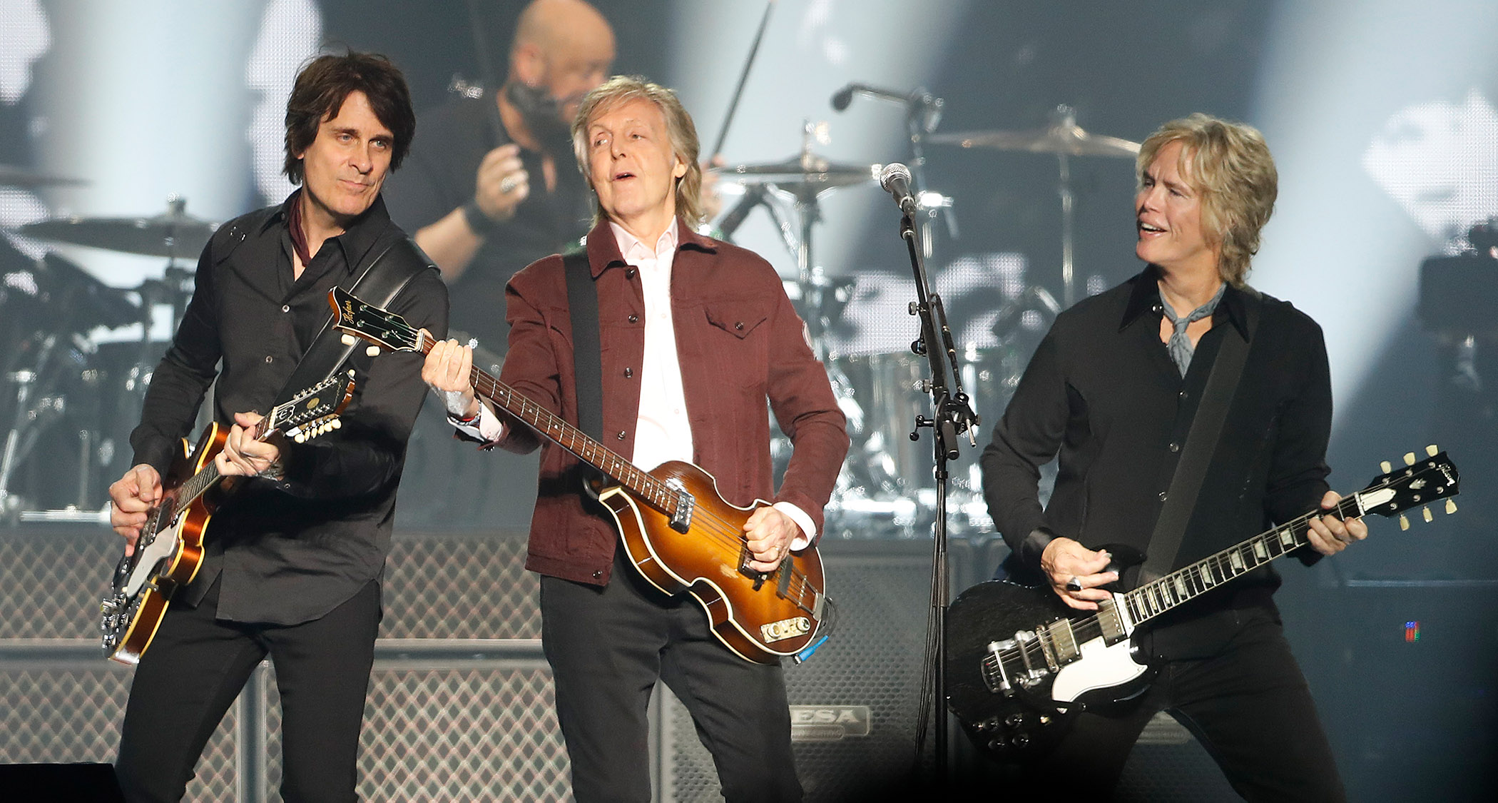 [L-R] Rusty Anderson, Sir Paul McCartney and Brian Ray play live, with McCartney playing one of his iconic Höfner basses