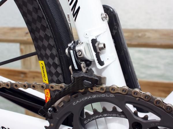 The Campagnolo Record front derailleur is bolted to a stout four-rivet mount