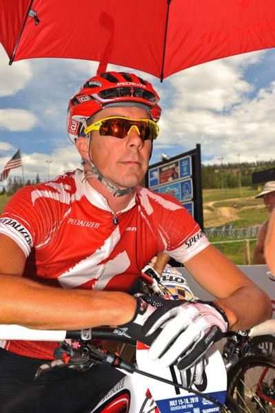 Specialized racer Todd Wells stays under the shade during race call-up.