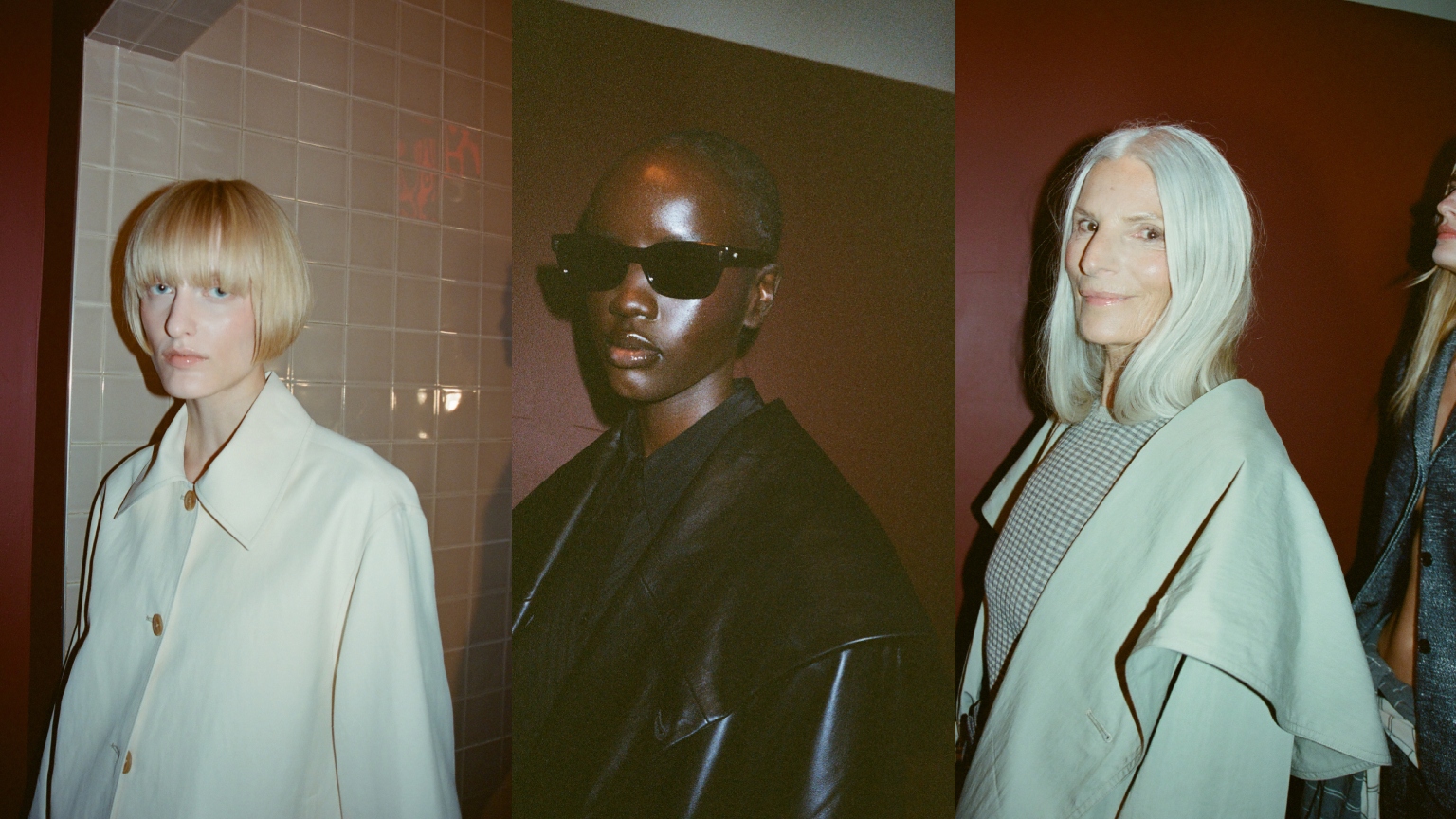three models with dewy skin wearing black and white jackets against a red wall