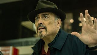 Batista holding up his hands after running into the landlord.