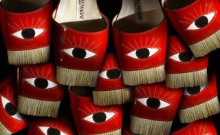 collection of red shoes with straw tufts and black eye