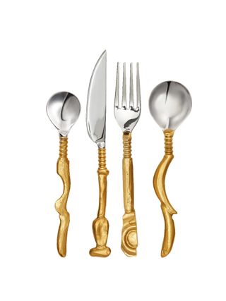 A cutlery set of two spoons, a fork, and a knife fetures golden-plated stems and silver sterling-plated tops and irregular shapes.