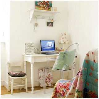 home office with white interiors and laptop