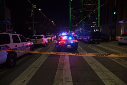 Police cars block the street in Dallas