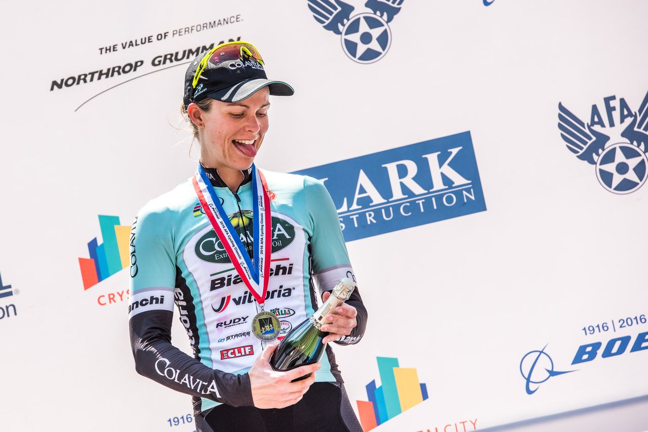 Kimberly Wells (Colavita) opens the champagne after her win