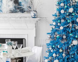 A light Christmas tree decorating scheme with bright blue tree