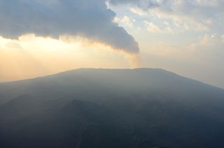 Volcanic gas steams from Nyamuragira volcano.